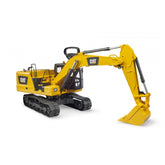 Yellow Bruder CAT Excavator toy with movable arm and shovel, on black tracks, set against a plain background.